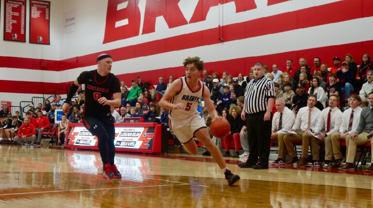 LE's Brady Neff drives against Circleville's Kole Nungester- Photo Credit: Aaron Glandon/Litter Media