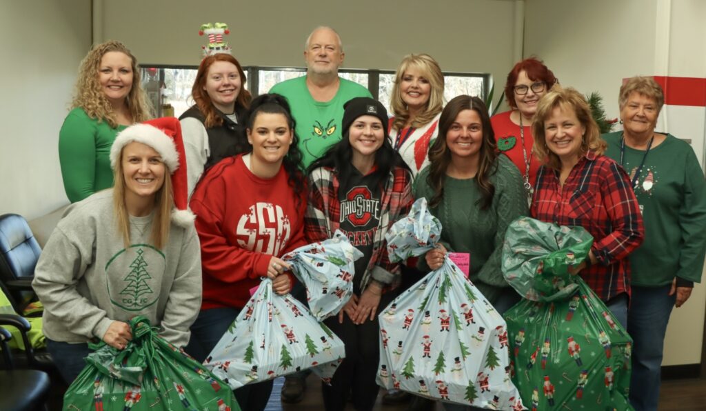 Front L-R: Gifts Coordinators Ellen Stone, Savanna Shaw, Shelby Blevins, Amy Crabtree, and Michelle Teeters, ornament coordinator; back, from left, Gifts Coordinators Ashley Jordan, and Olivia Cornwell, CGFC President Gary Crandall, and Gifts Coordinators Lisa McCain, Mary Ellen Rooney, and Chris Stumbo.