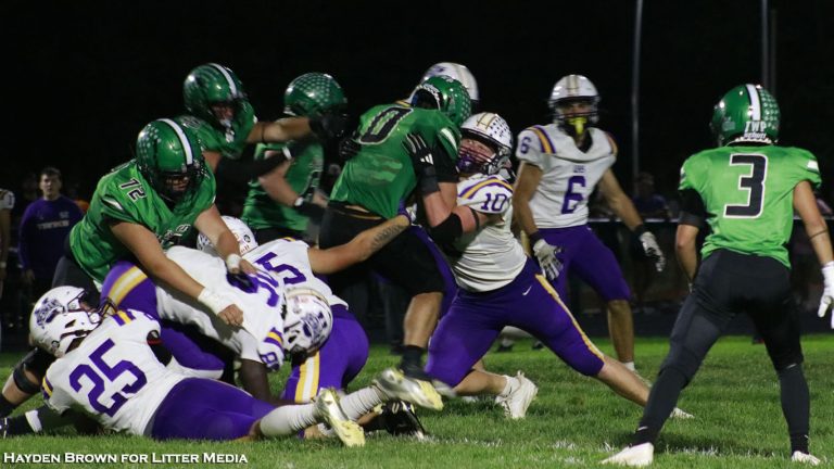 Unioto's David Long puts the stop on Huntington's Evan Thomas in the Shermans' 49-7 win to open the SVC season. Hayden Brown for Litter Media