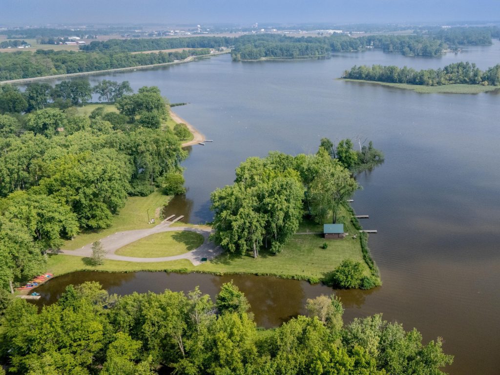 Aerial view of Lake Loramie State Park. Air temperatures are rising but water temperatures remain dangerously cold. Wear a life jacket every time you are on our near the water. 