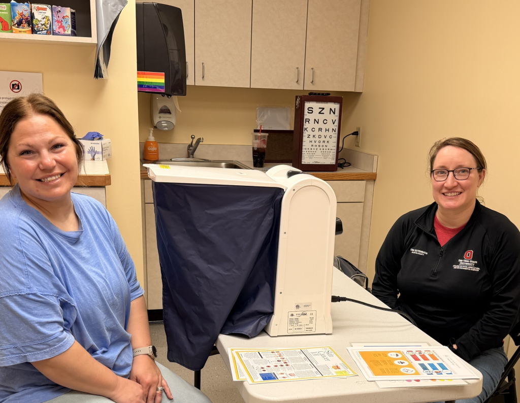 Fayette County Public Health Director of Nursing Ashley Roberts (left) received a Dermascan screening performed by OSU Fayette County Extension Educator Sarah Sowell at a recent clinic.