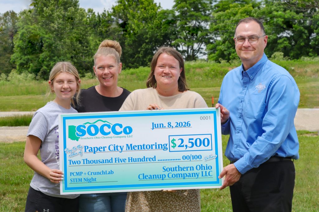 SOCCo President and CEO, Pat Timbes, right, presents a check for $2,500 to representatives of the Paper City Mentoring Project. From left Paper City Mentor Project Teen Avah Street, Paper City Mentor Project Match Specialist Laken Woods, and Executive Director Asti Powell.