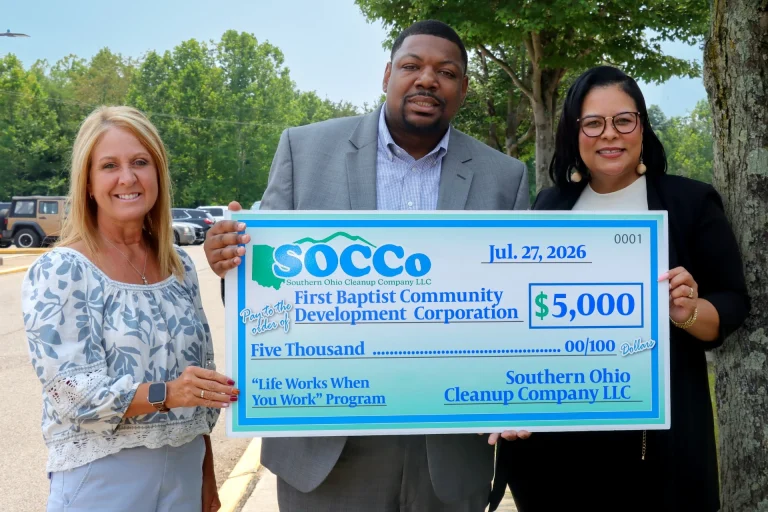 From left, Southern Ohio Cleanup Company Director of Communications, Shawn Jordan, presents a check for $5,000 to Pastor Moses Edwards, Jr. and Jill Edwards from the First Baptist Community Development Corporation. The funds will be used for the Life Works When You Work program.