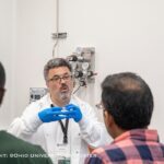 OHIO Professor Savas Kaya instructs participants of an ASCENT Semiconductor Workshops as they learn about the steps involved in wafer fabrication processing as well as clean room operations and chip packaging.