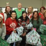 Front L-R: Gifts Coordinators Ellen Stone, Savanna Shaw, Shelby Blevins, Amy Crabtree, and Michelle Teeters, ornament coordinator; back, from left, Gifts Coordinators Ashley Jordan, and Olivia Cornwell, CGFC President Gary Crandall, and Gifts Coordinators Lisa McCain, Mary Ellen Rooney, and Chris Stumbo.