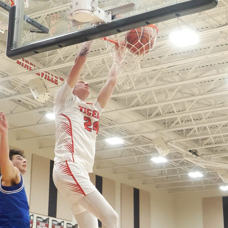 Circleville's Ed Kirk gets a break away dunk with 35 seconds left in double overtime to solidify a 48-44 Tigers win over Gallia Academy in their 2025 tounament game. Aaron Glandon/Litter Media