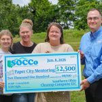SOCCo President and CEO, Pat Timbes, right, presents a check for $2,500 to representatives of the Paper City Mentoring Project. From left Paper City Mentor Project Teen Avah Street, Paper City Mentor Project Match Specialist Laken Woods, and Executive Director Asti Powell.