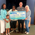 From left, Alece Cowen, Wings of Hope; Braszen Nelson, camper; Wings of Hope Founder and CEO, Maxine Malone; SOCCo President and CEO, Pat Timbes, and Linda Nichols, Wings of Hope.
